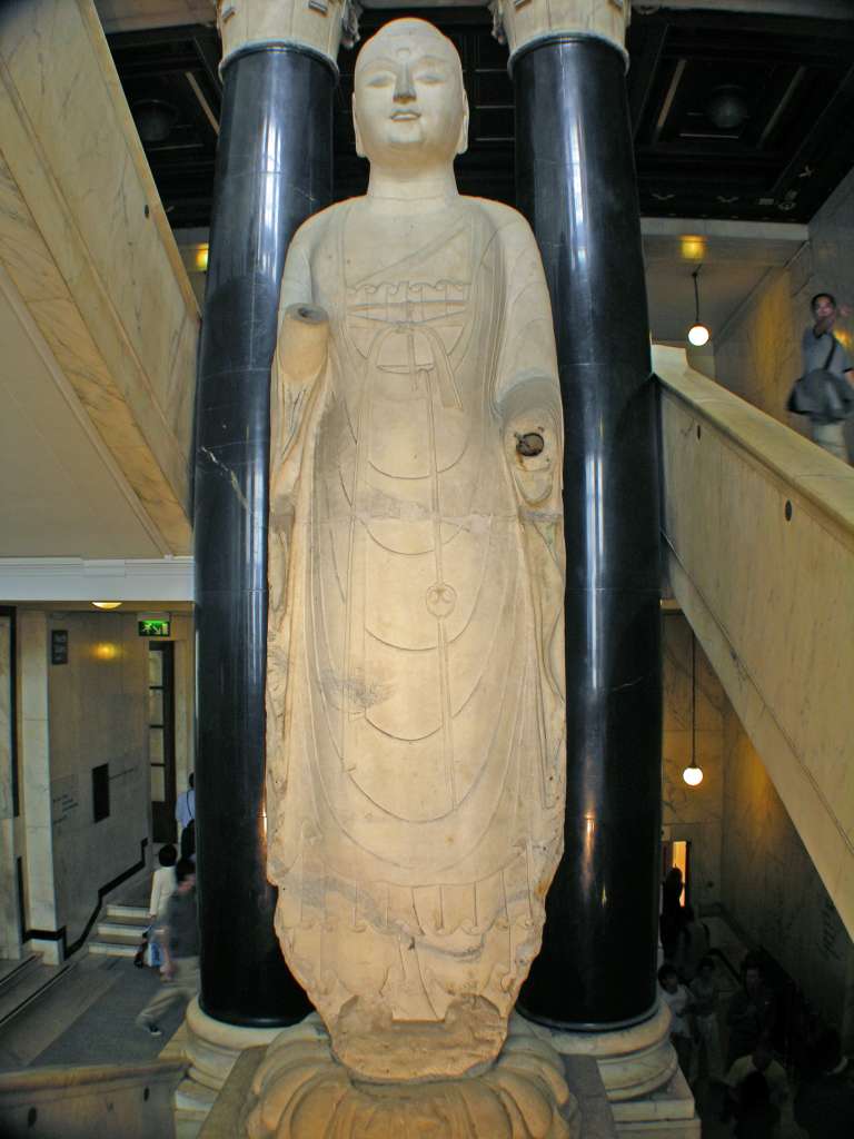 British Museum Top 20 Buddhism 02 Marble Buddha Amitabha 2. Amitabha - North China, 585AD, 5.8m high. This marble statue of the Meditation Buddha of the west has a very solid form and drapery in extremely flat folds.